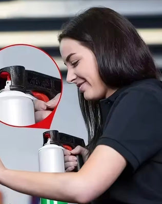 Plastic portable spray paint handle by Problems Solved, reusable and universal, shown attached to a spray can for easy grip.