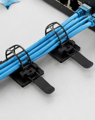 Problems Solved 3M self-adhesive cable organizer pack with 25 clips for keeping desk cables tidy and organized.