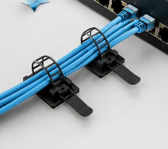 Problems Solved 3M self-adhesive cable organizer pack with 25 clips for keeping desk cables tidy and organized.