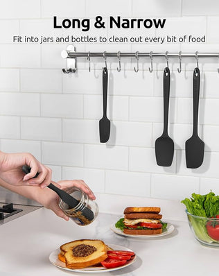 Set of four silicone spatulas from Problems Solved, heat-resistant up to 315°C, flexible, with colorful handles for cooking and baking.