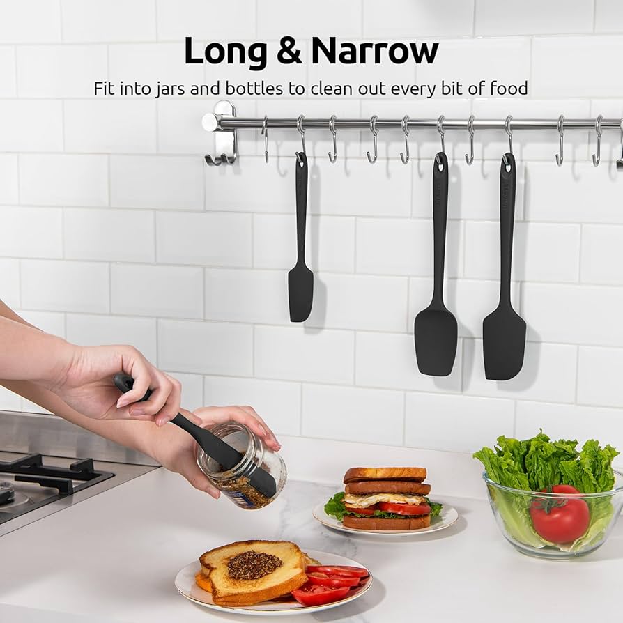 Set of four silicone spatulas from Problems Solved, heat-resistant up to 315°C, flexible, with colorful handles for cooking and baking.