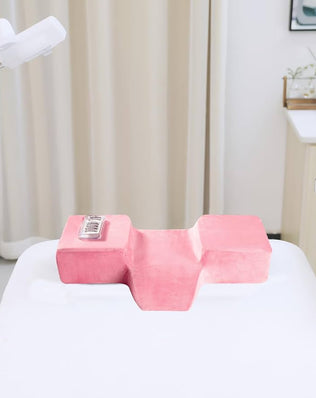 Memory foam eyelash extension pillow by Problems Solved designed for beauty salons, provides neck support during eyelash extension treatments.