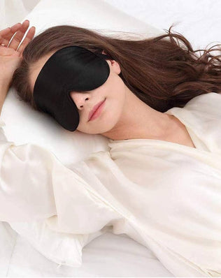 Organic silk sleep mask by Problems Solved with soft padding and lightweight design, perfect for smooth skin and restful sleep.