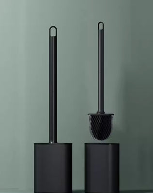 Stainless steel base toilet brush holder with standing toilet cleaning brush from Problems Solved, designed for bathroom cleaning.
