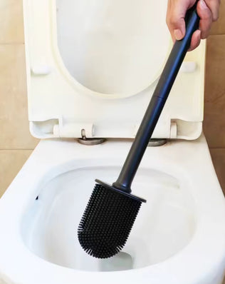 Stainless steel base toilet brush holder with standing toilet cleaning brush from Problems Solved, designed for bathroom sanitation.