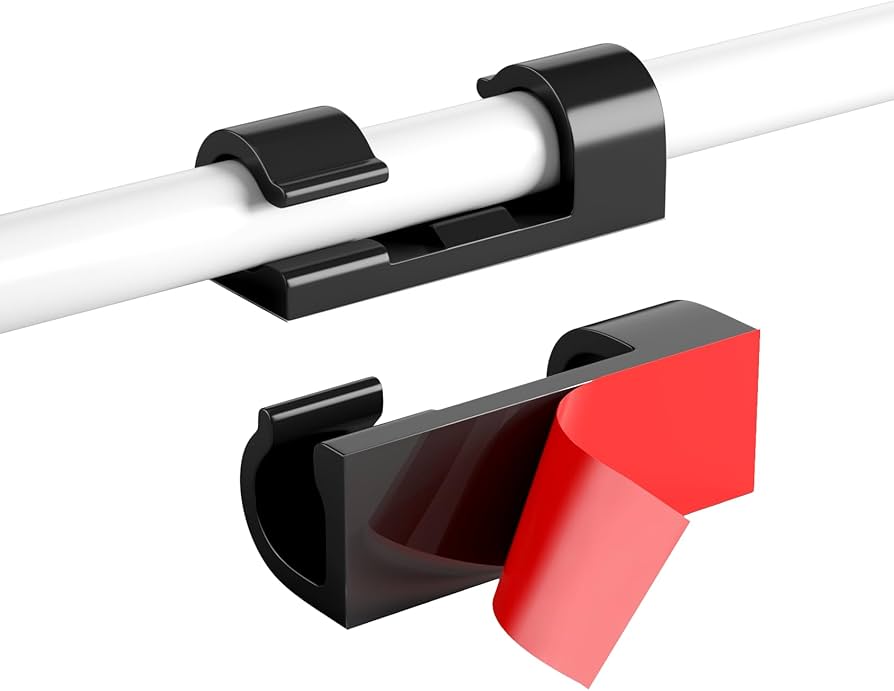 40-pack Problems Solved adhesive cable clips for wire management, shown holding various cables on a home office desk.