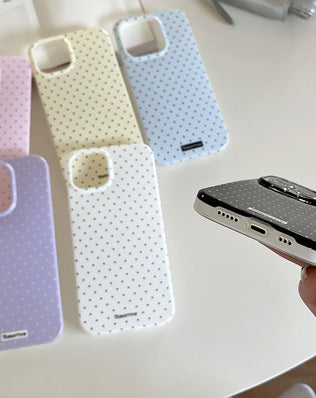 Problems Solved Reownest iPhone 13/14 case with a cute polka dot pattern and aesthetic design, showing the colorful patterned phone cover.