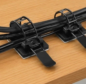 Pack of 25 Problems Solved 3M self-adhesive cable organizers for desk, keeping cables tidy and organized.