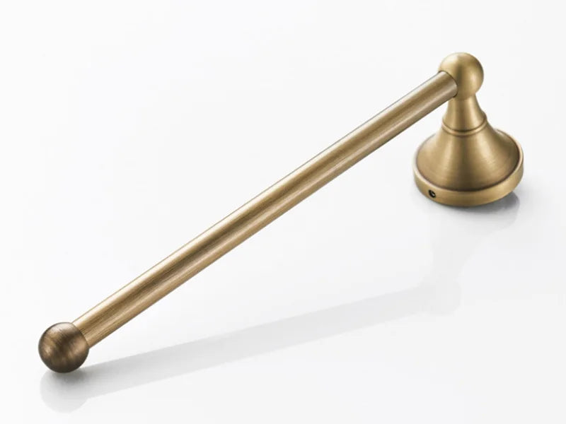 Antique brass wall-mounted toilet paper holder by Problems Solved, designed for bathroom accessories.