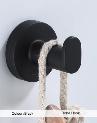 Black bathroom hardware set including robe hook, towel rail, bar rack, shelf, and tissue paper holder by Problems Solved