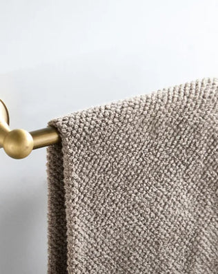 Antique brass wall-mounted toilet paper holder from Problems Solved, with a classic design and sturdy mounting for bathroom decor.