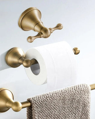 Antique brass wall-mounted toilet paper holder from Problems Solved bathroom accessories collection.