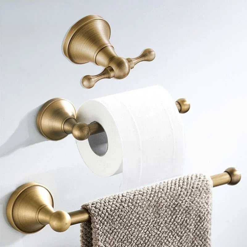 Antique brass wall-mounted toilet paper holder from Problems Solved bathroom accessories collection.